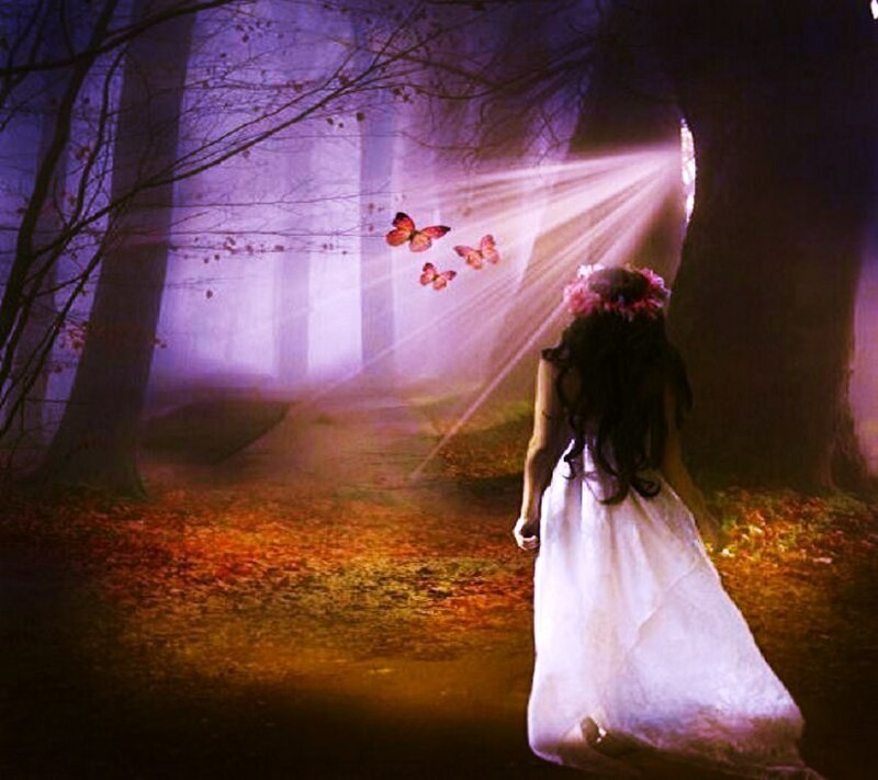 woman in forest with butterflies