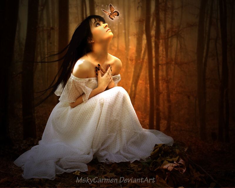 woman in forest with butterfly