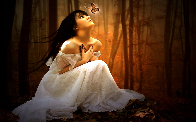 woman in forest with butterfly