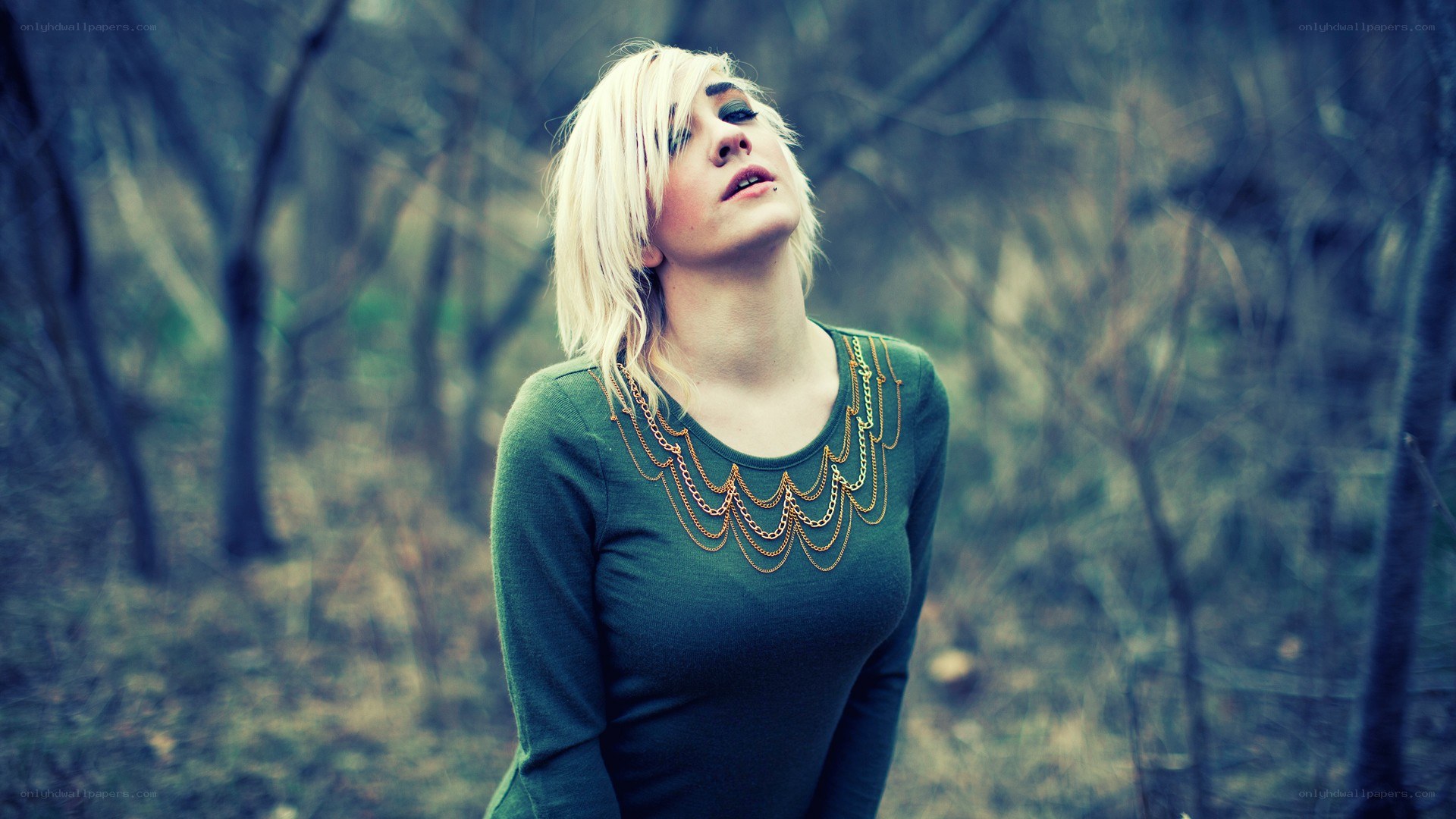 woman in forest with chains