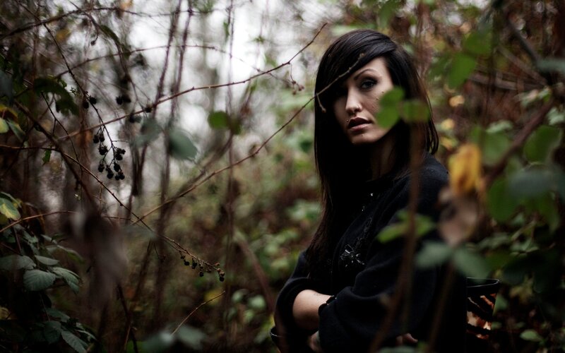 woman in forest with dark hair