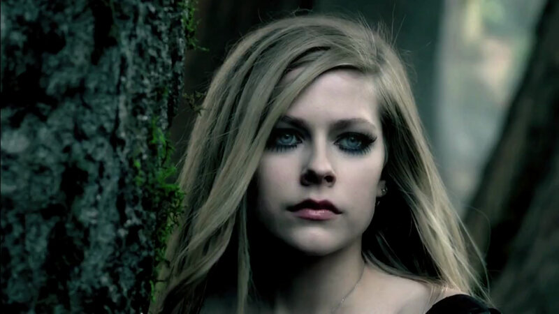 woman in forest with dark makeup