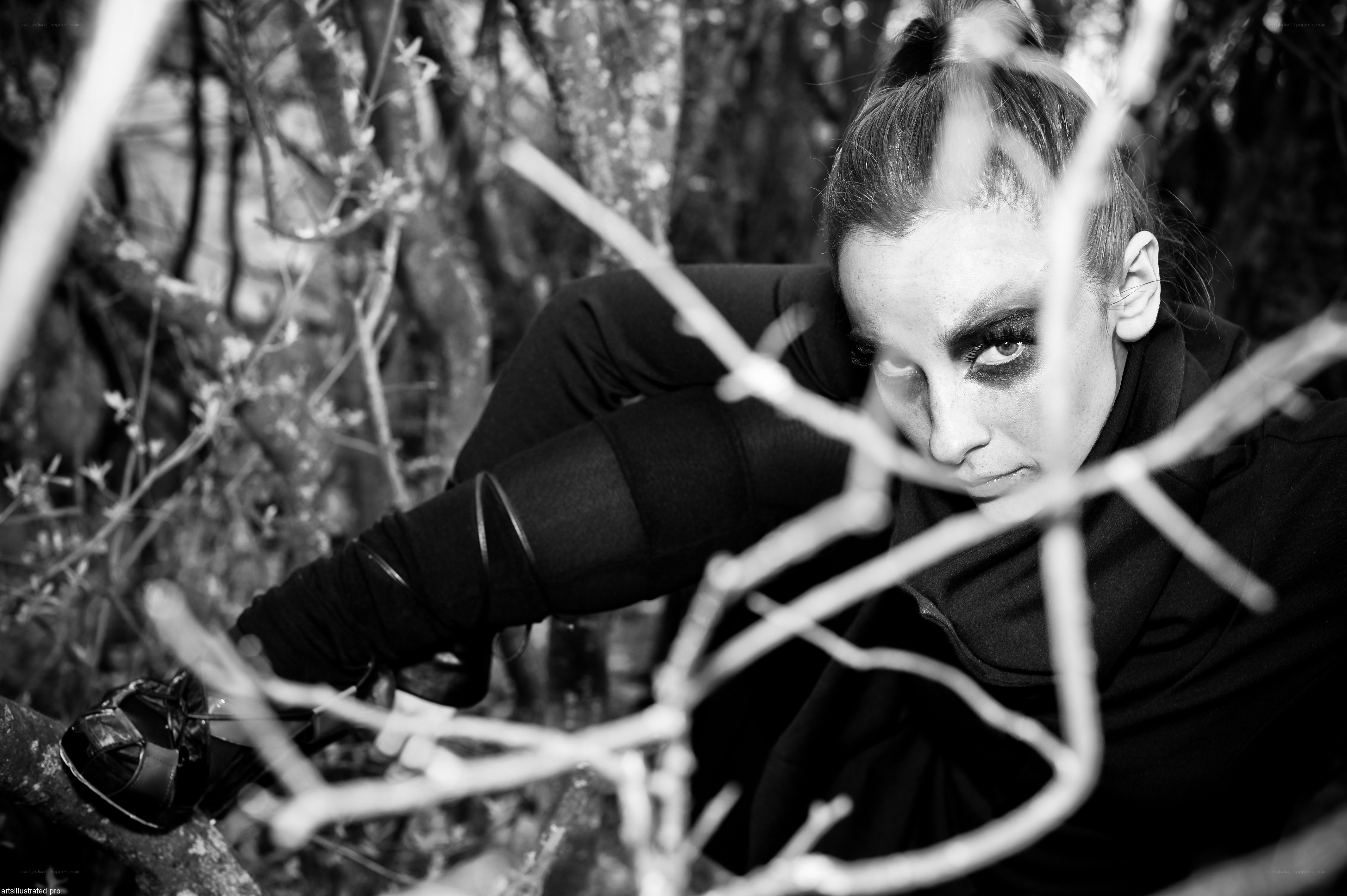 woman in forest with dramatic makeup