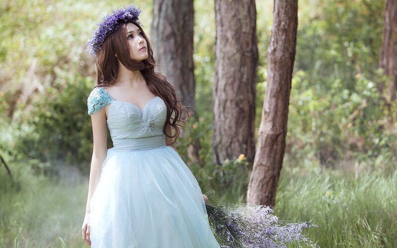 woman in forest with flowers