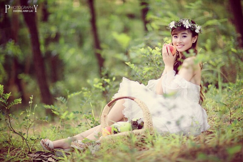 woman in forest with fruit