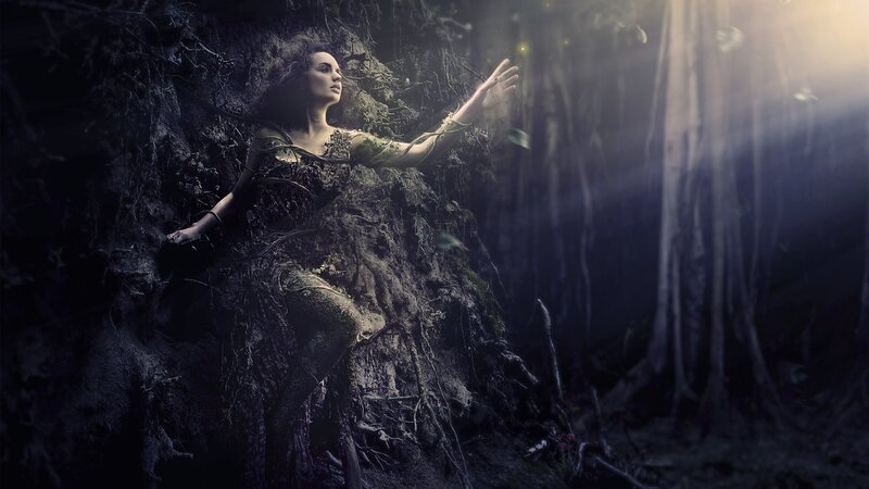 woman in forest with glowing light