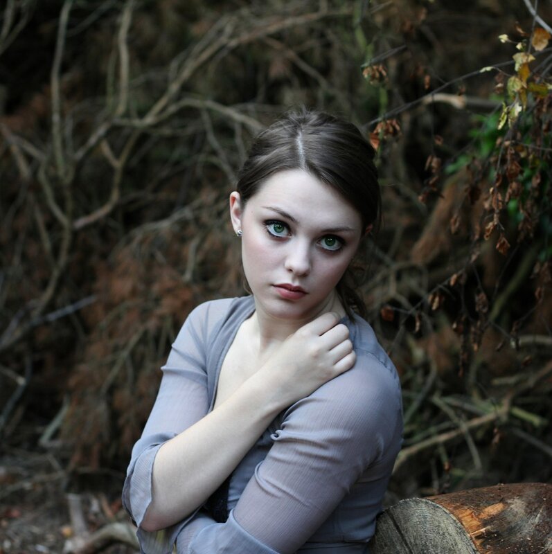 woman in forest with green eyes