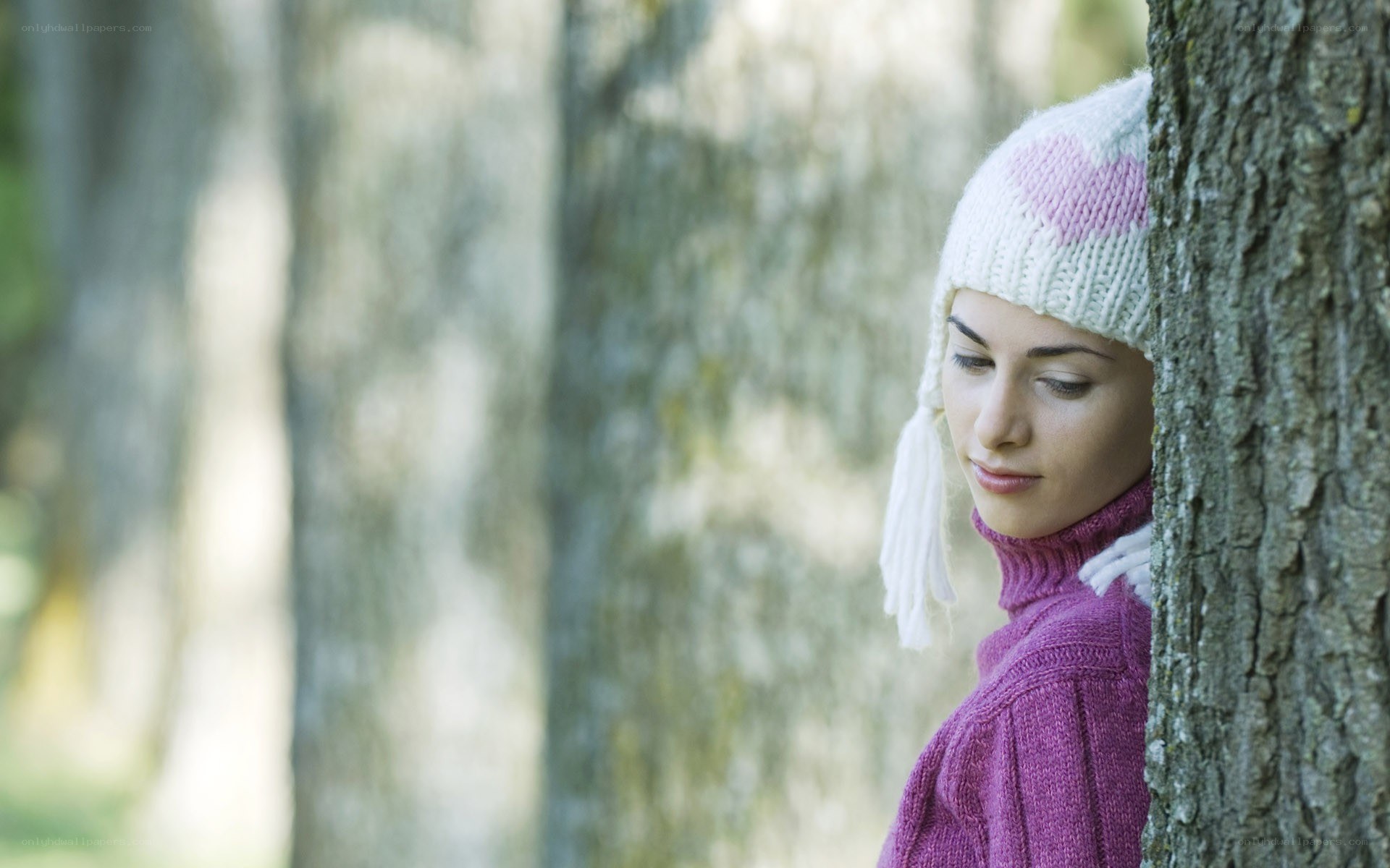woman in forest with hat