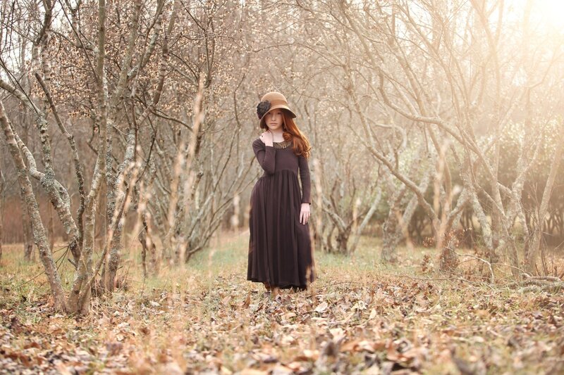 Woman in forest with hat