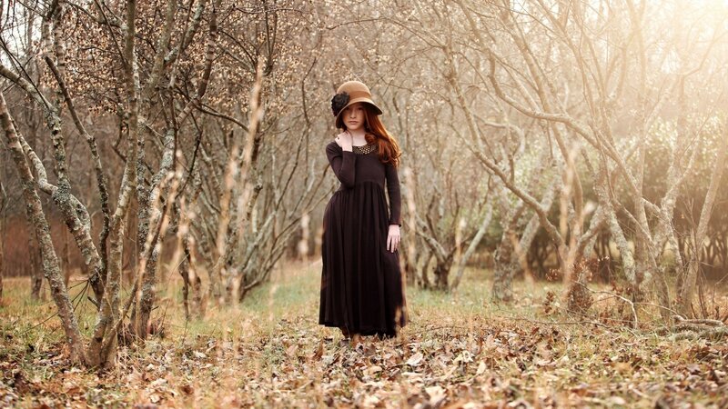 Woman in forest with hat