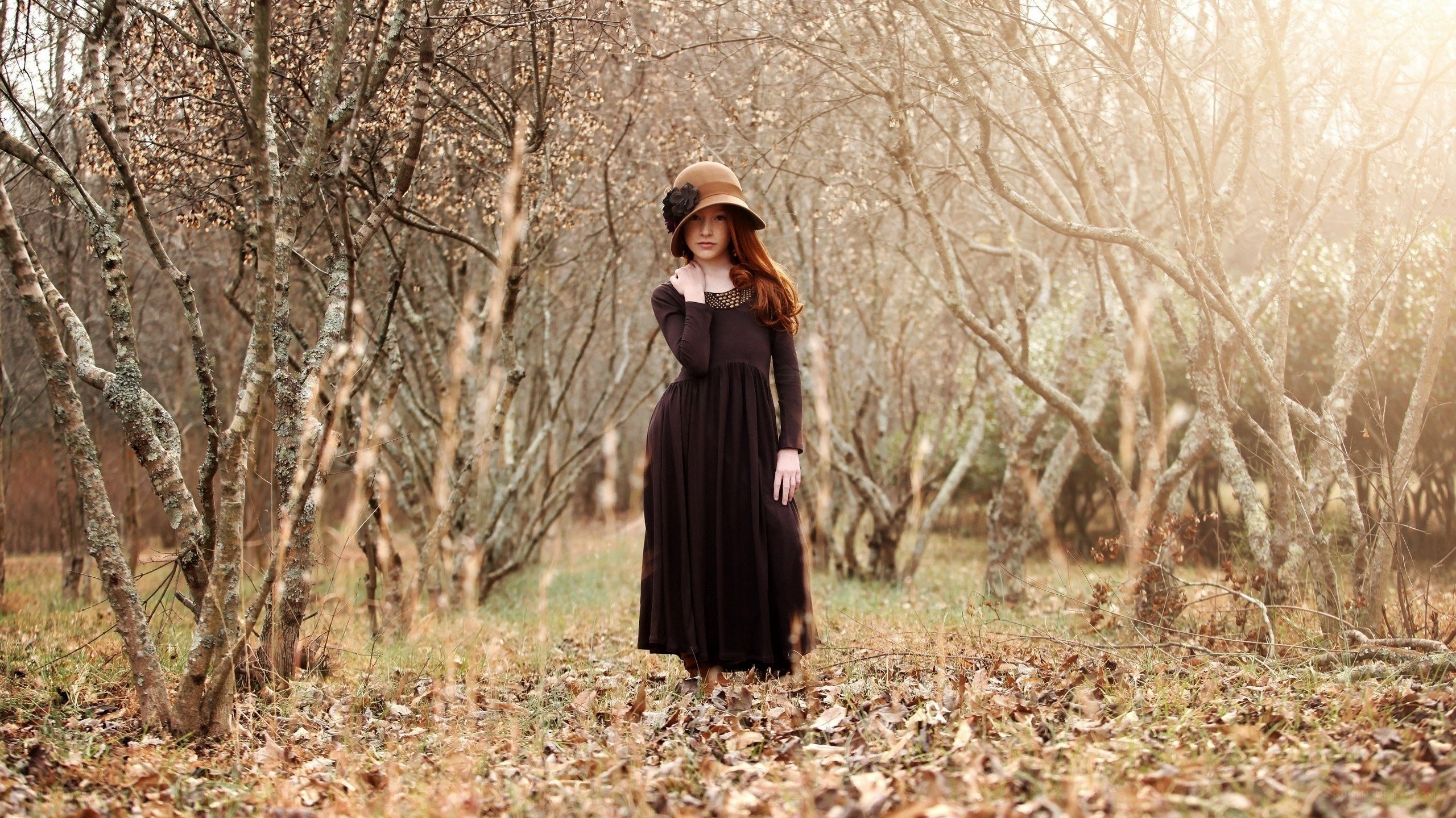 Woman in forest with hat