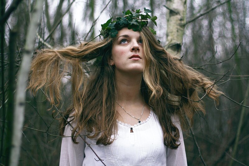 woman in forest with ivy crown