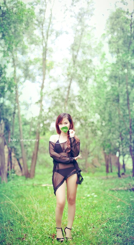 woman in forest with leaf