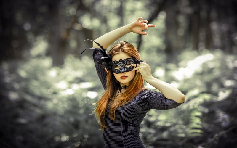 woman in forest with mask