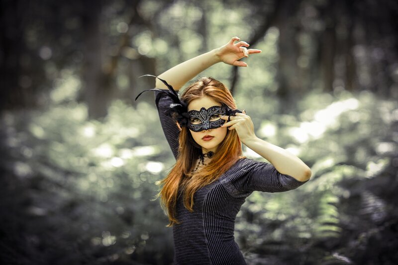 woman in forest with mask