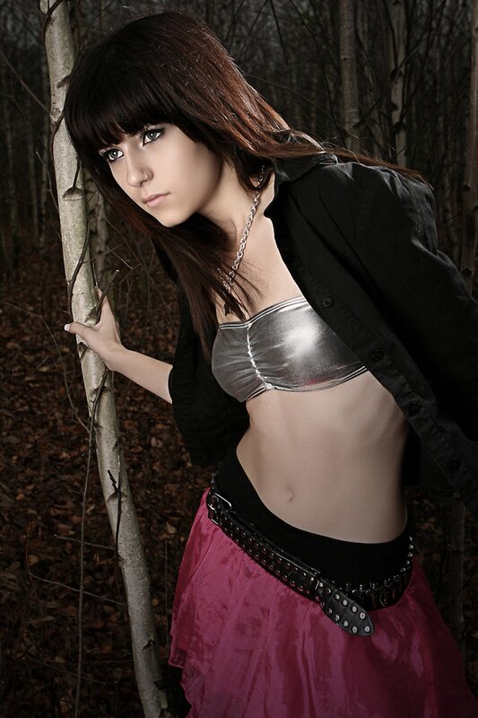 woman in forest with metallic top