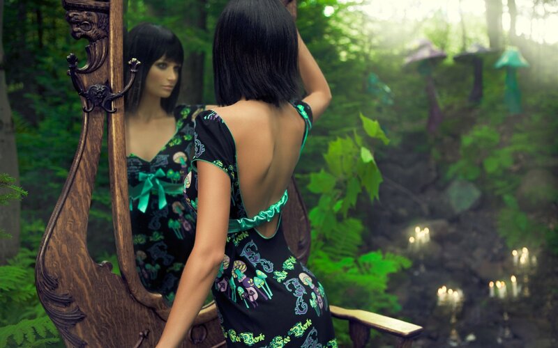 woman in forest with mirror