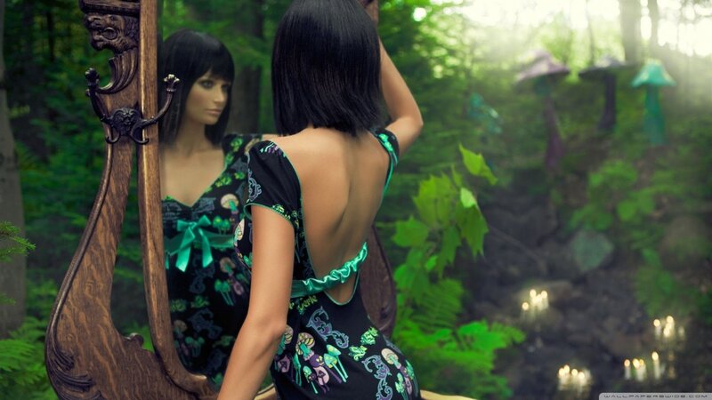 woman in forest with mirror