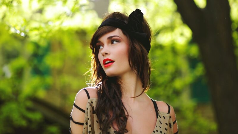 woman in forest with red lipstick