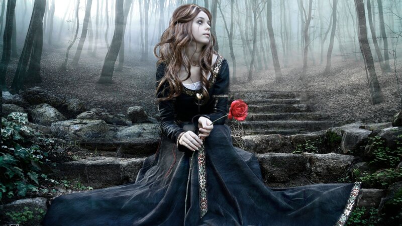 woman in forest with red rose