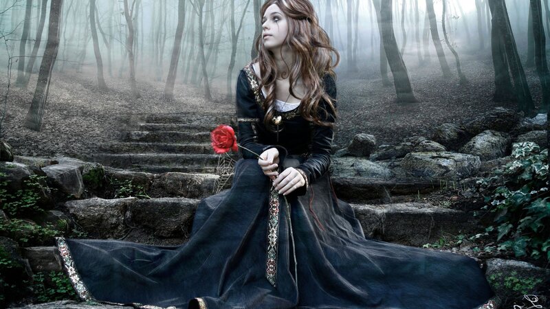 woman in forest with rose