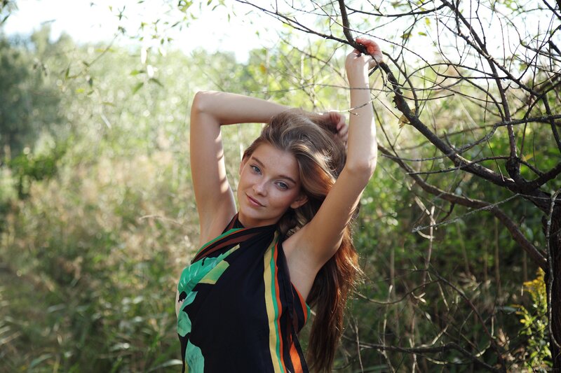 woman in forest with scarf