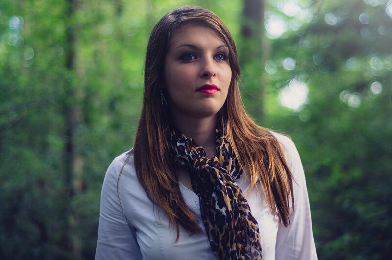woman in forest with scarf