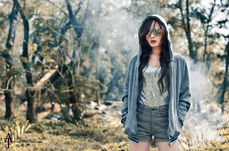 woman in forest with smoke