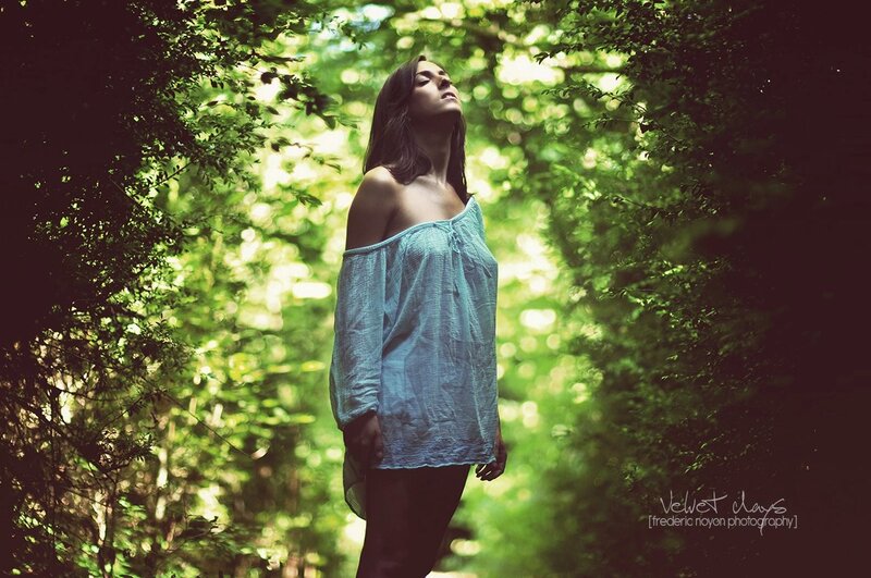 woman in forest with sunlight