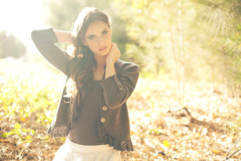 woman in forest with sunlight