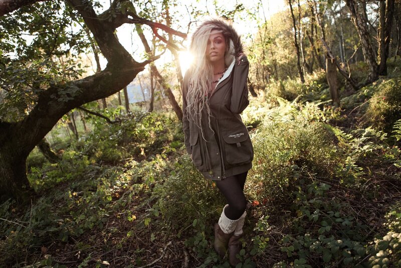 Woman in forest with sunlight