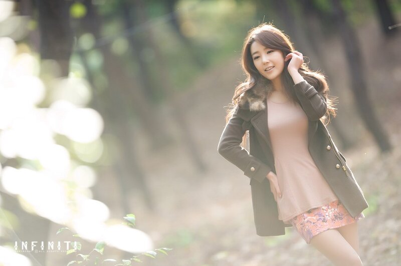 woman in forest with sunlight