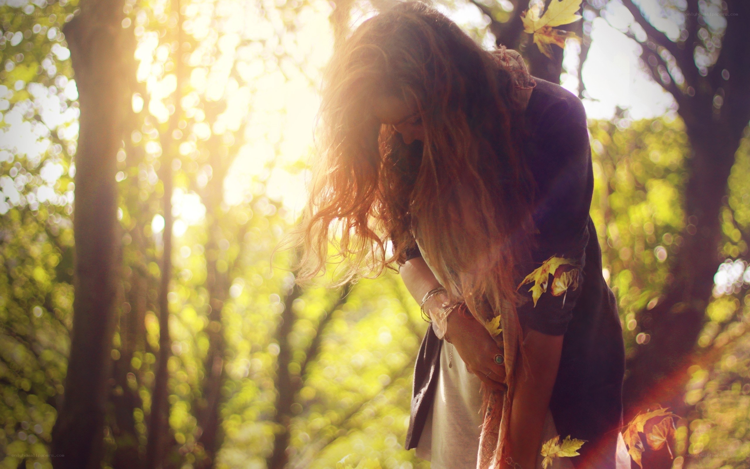 woman in forest with sunlight