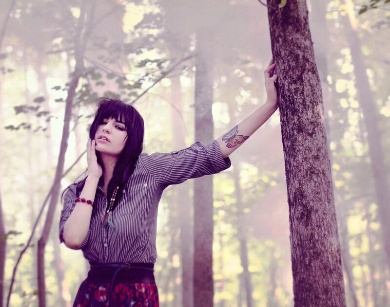 woman in forest with tattoo