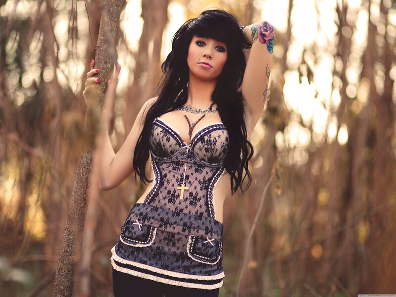 woman in forest with tattoos