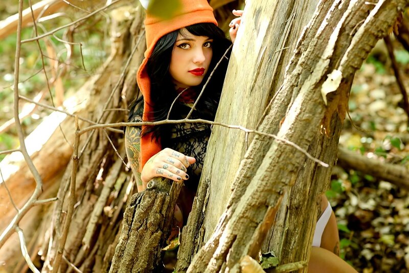woman in forest with tattoos