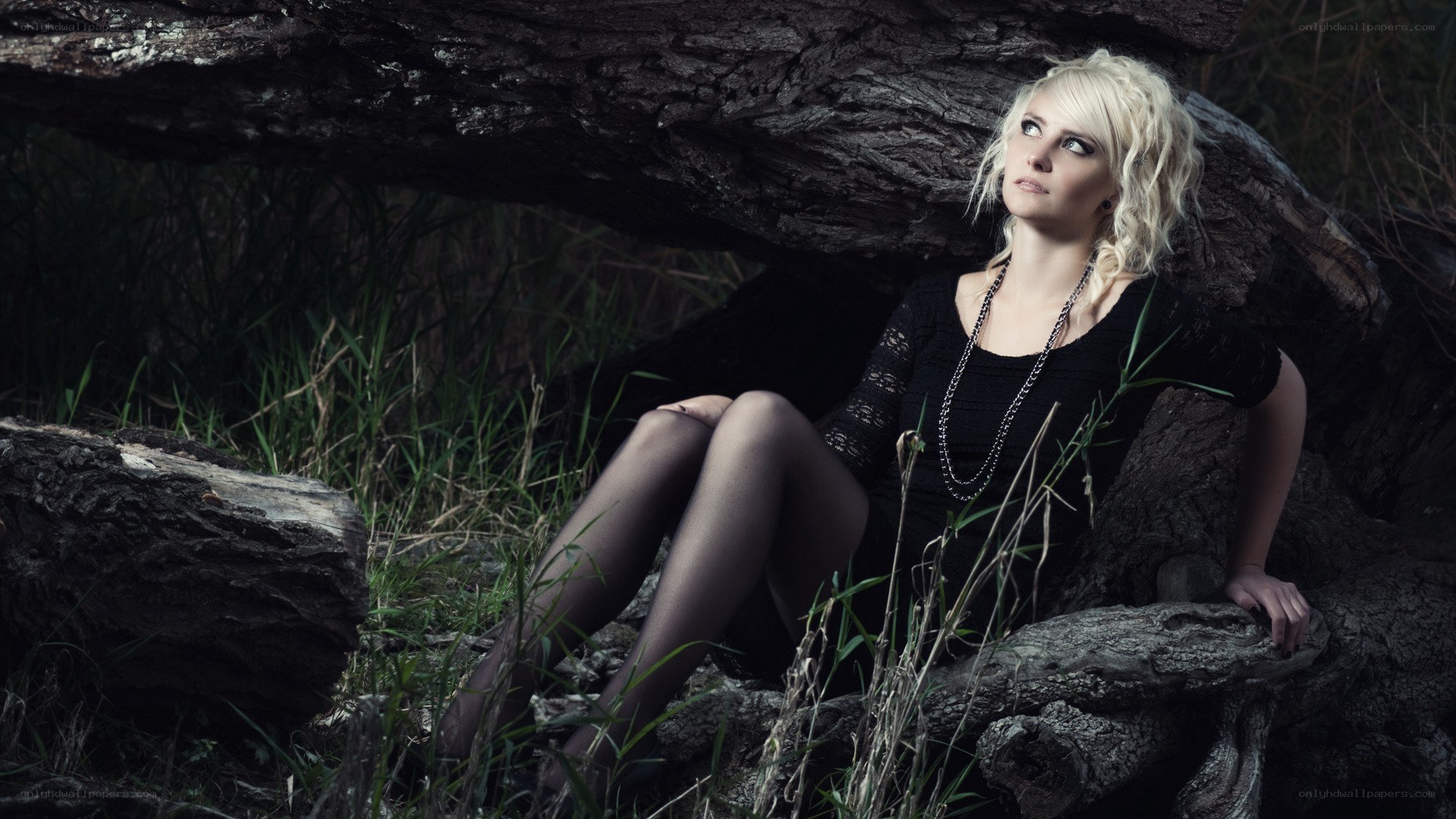 Woman in forest with tree