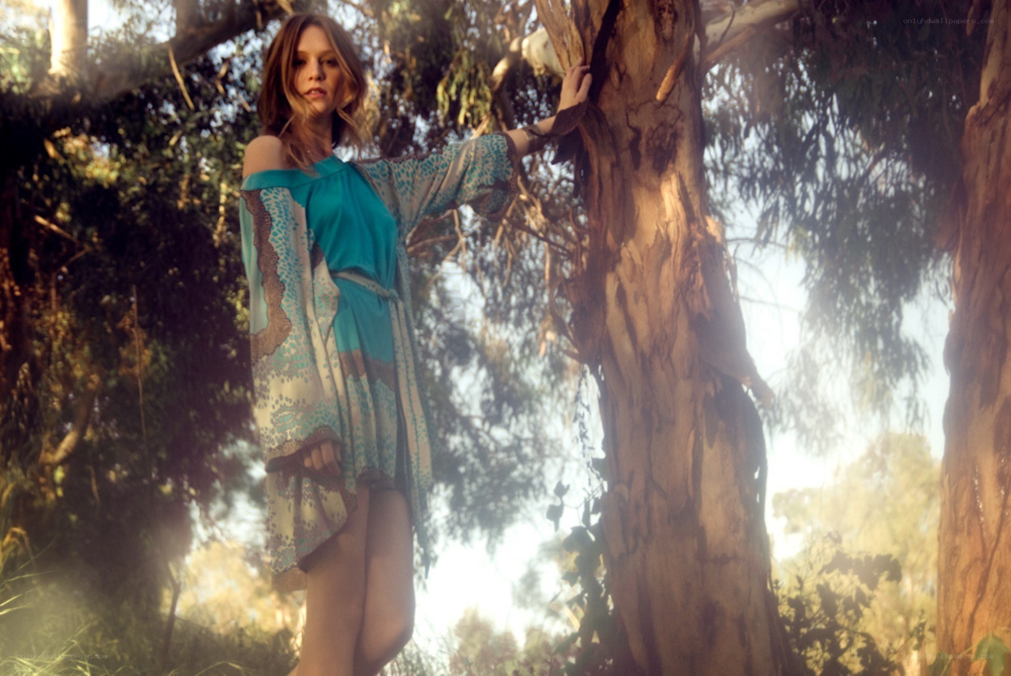 woman in forest with tree