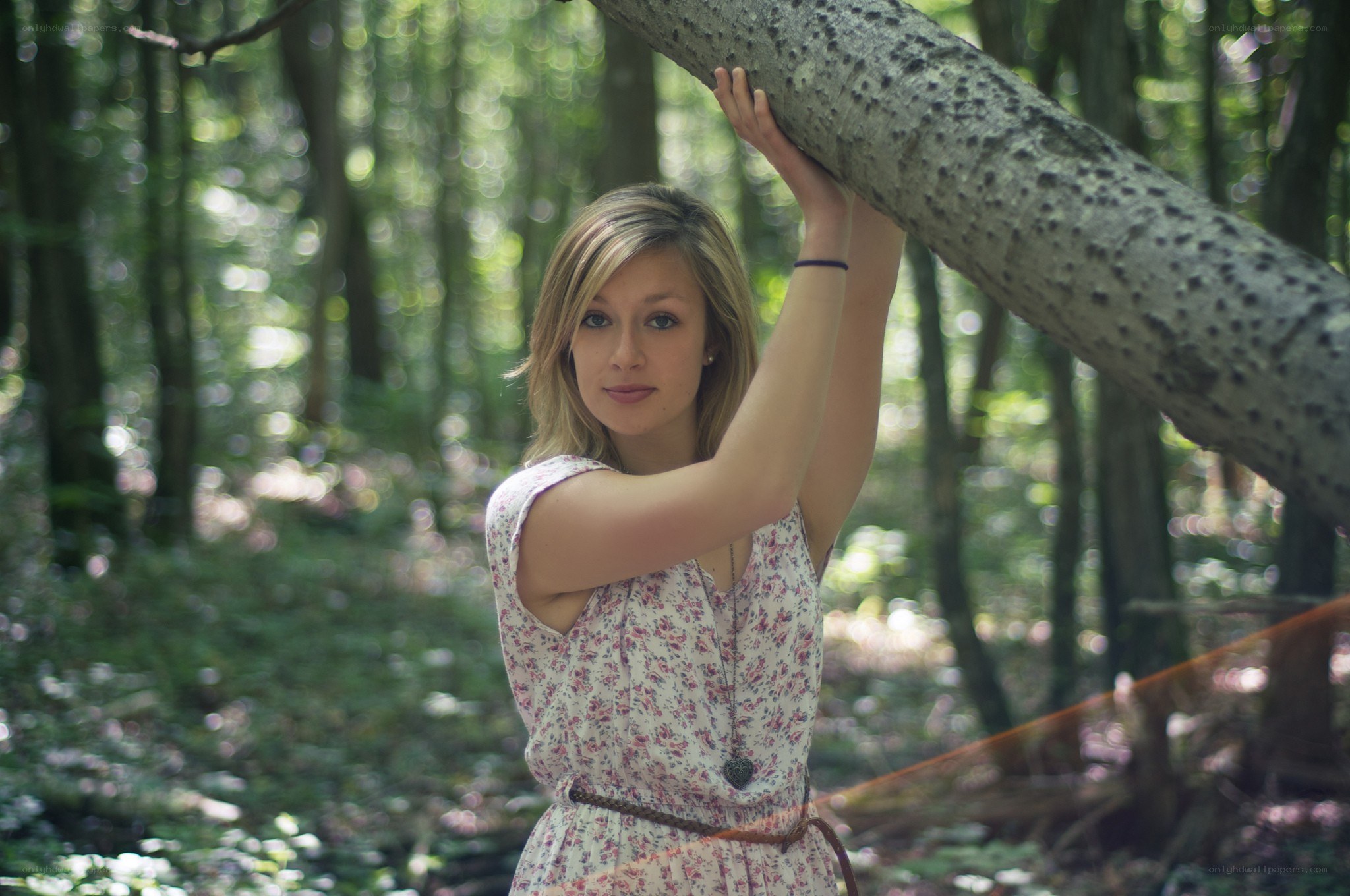 woman in forest with tree