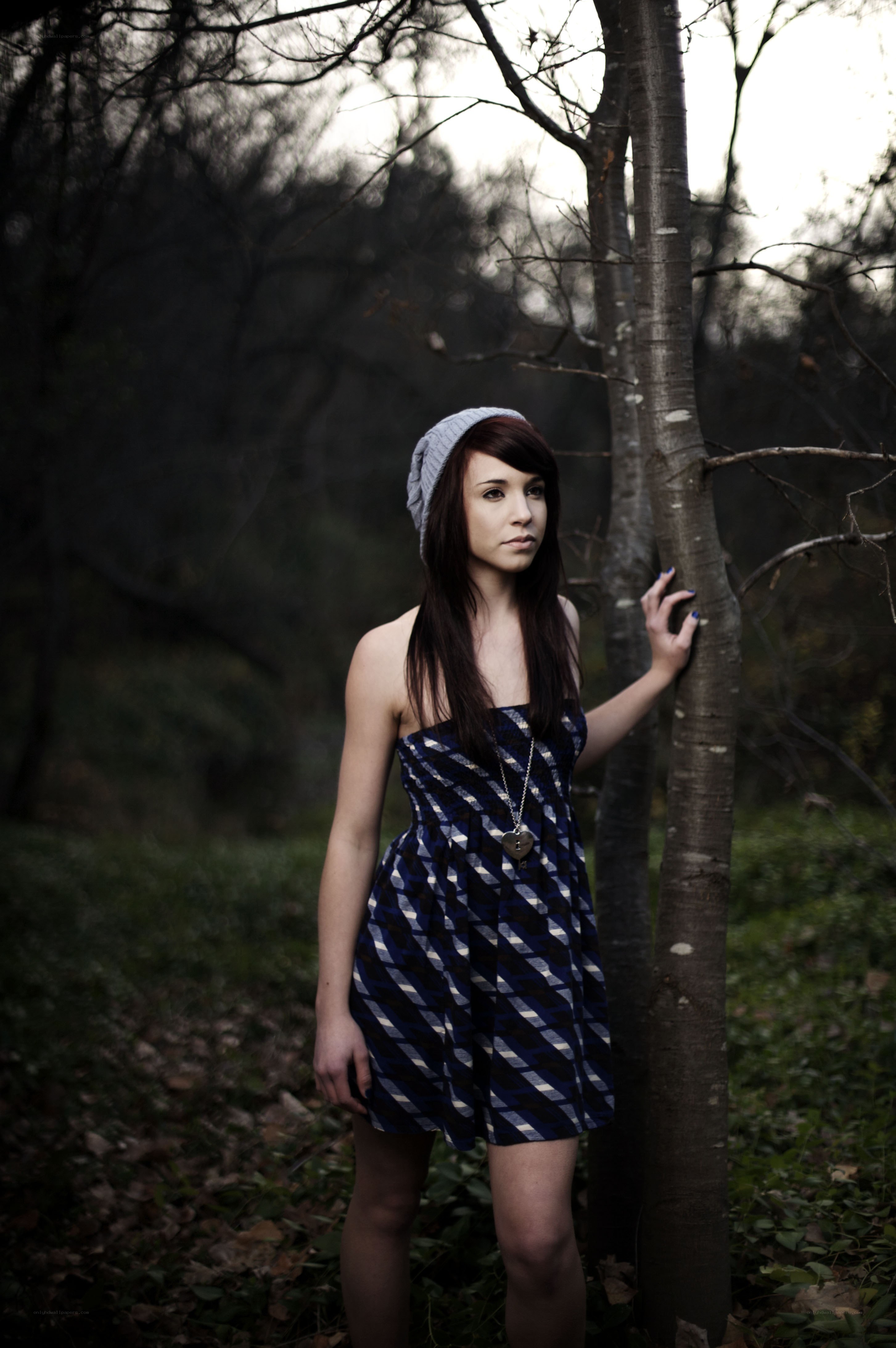 woman in forest with tree