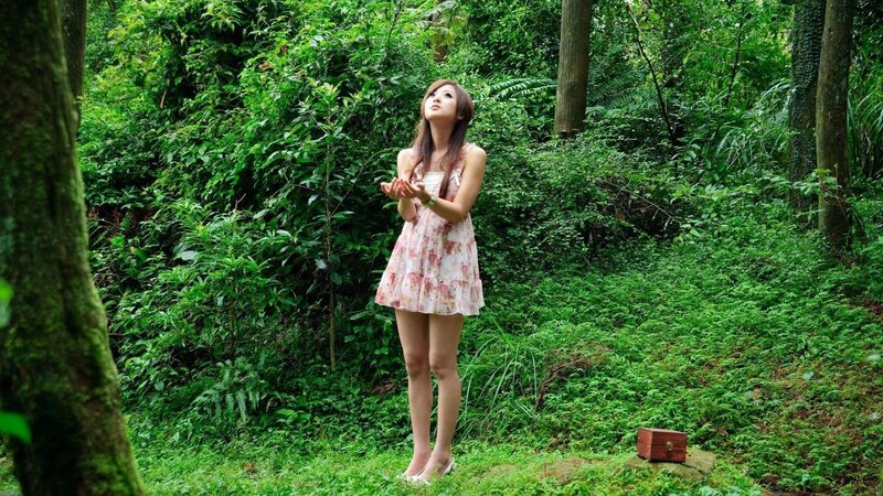 woman in forest with wooden box