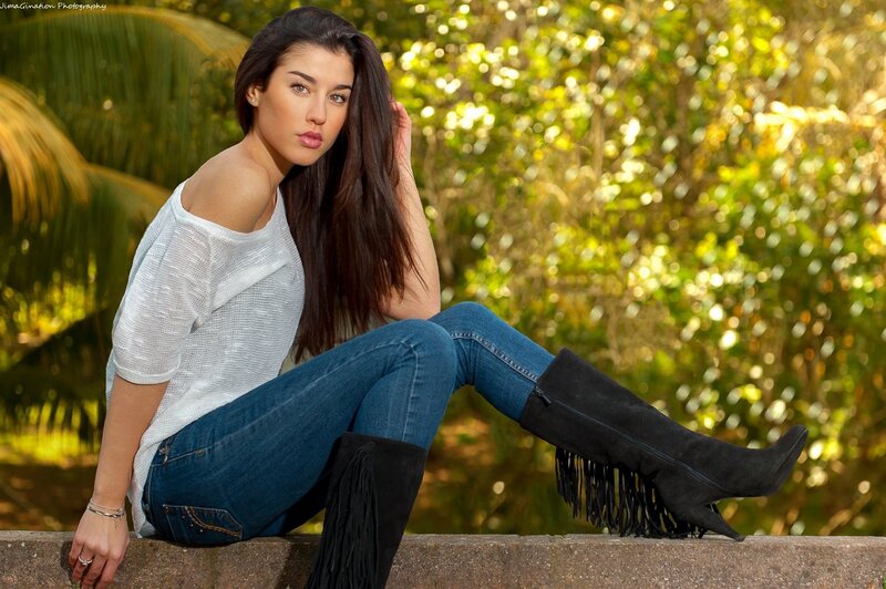 woman in fringed boots sitting outside