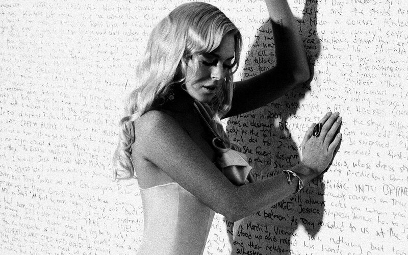 Woman in front of a wall