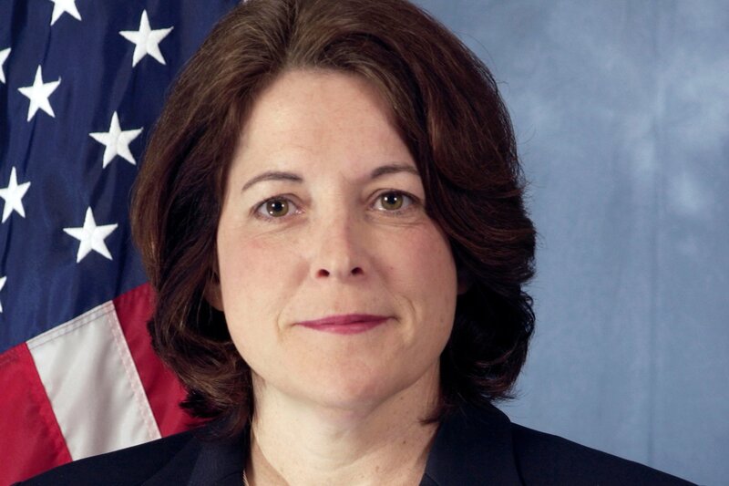 woman in front of american flag
