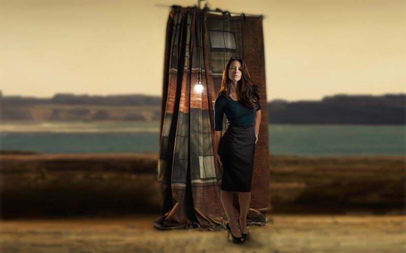 Woman in front of brick structure