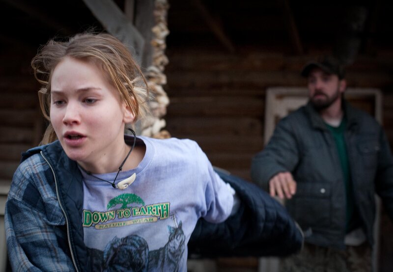 woman in front of cabin