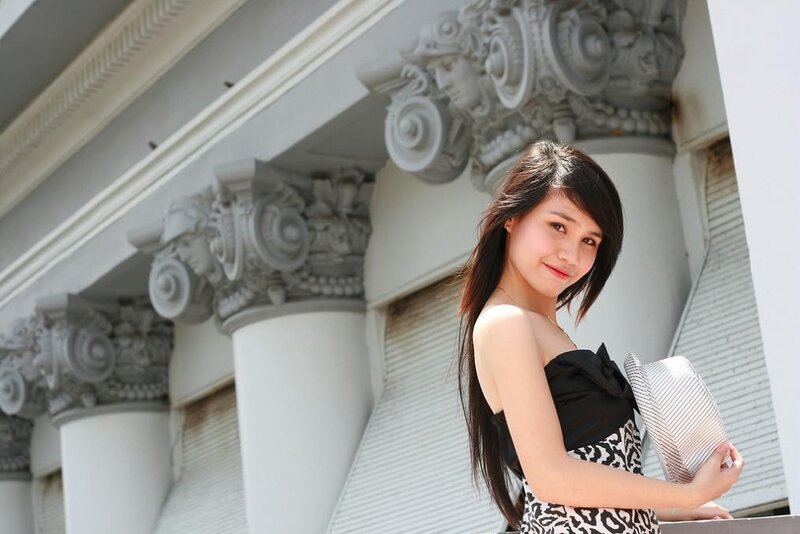 woman in front of classical building