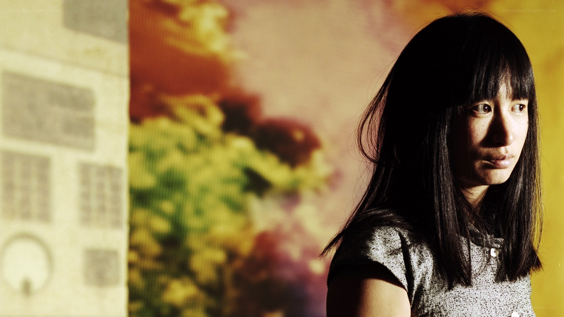woman in front of colorful background