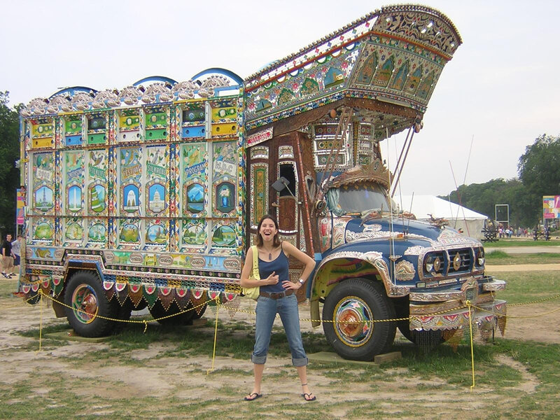 Woman in front of decorated truck