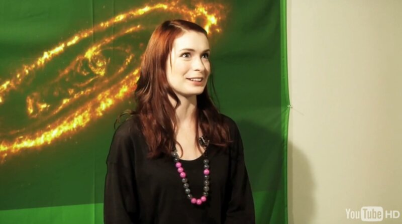 woman in front of galaxy backdrop